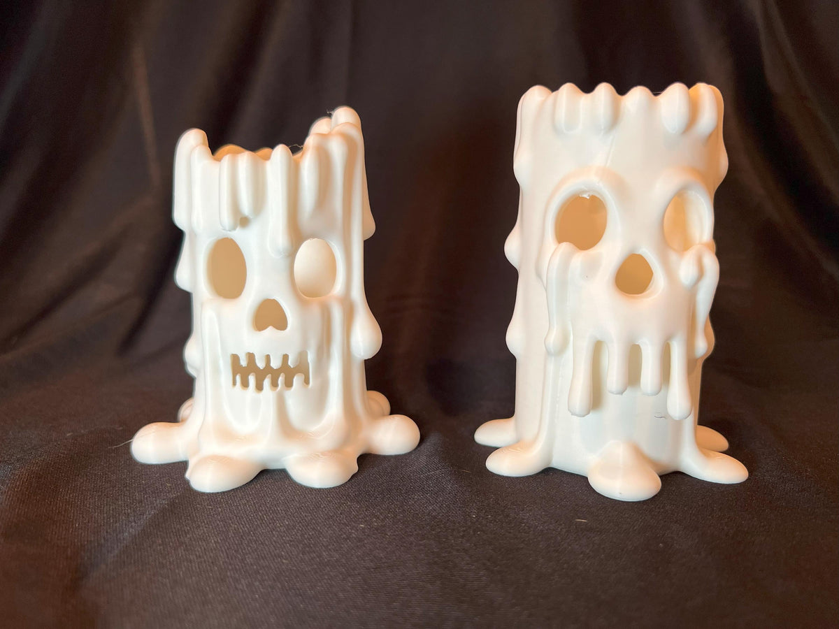 Halloween Skull Candle Pair: Gothic Melting Wax LED Decor